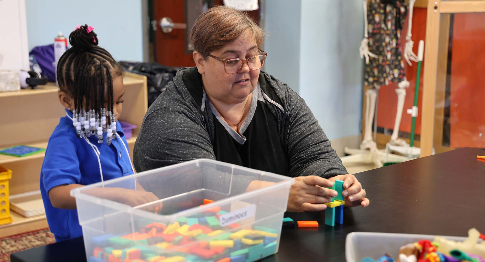 Teacher helping student