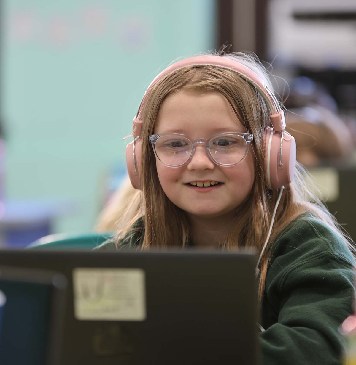 Student drawing in a classroom.