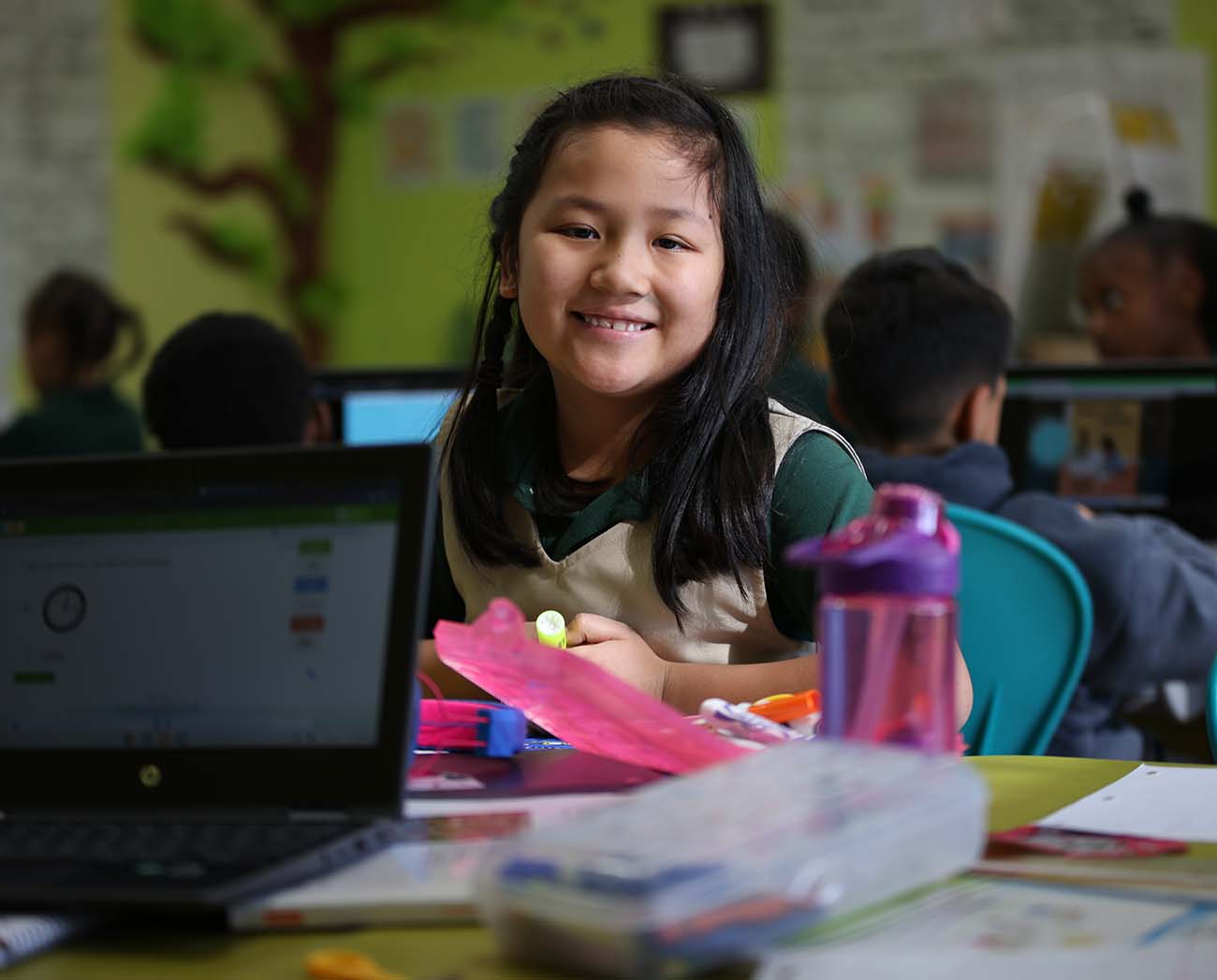 Smiling children together outdoors.